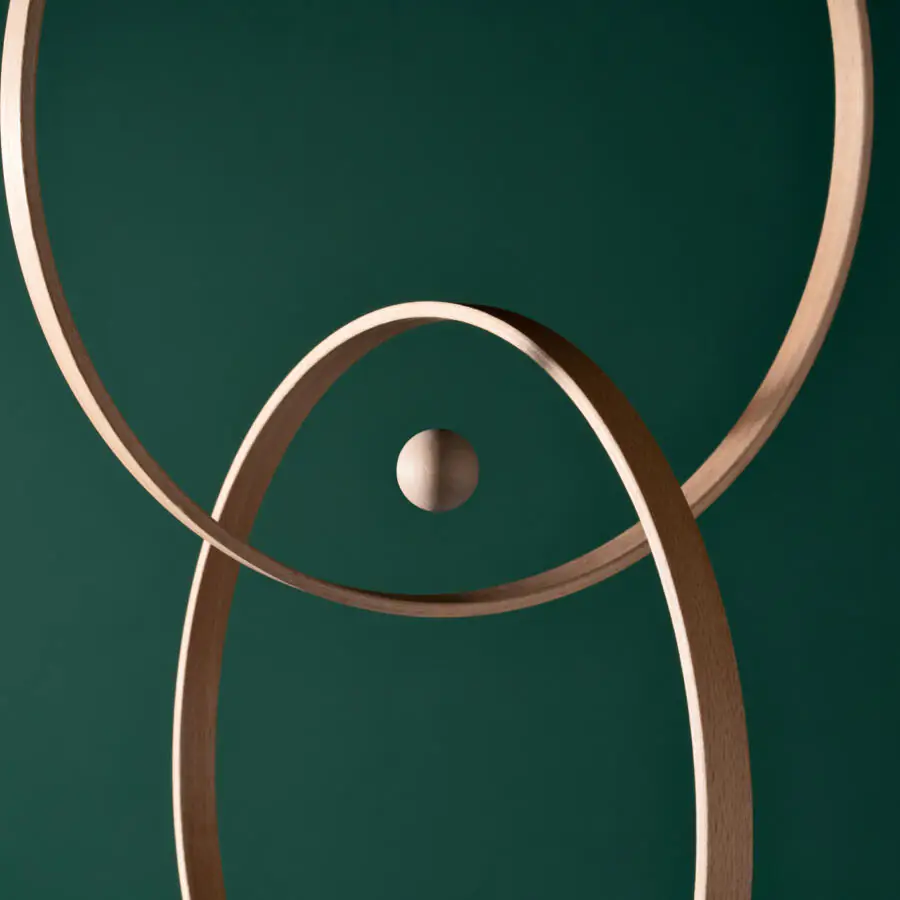 A Wooden Sphere in the Center of Intersected Rings